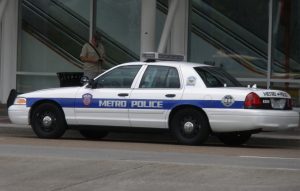 police car pulling over people who are texting and driving